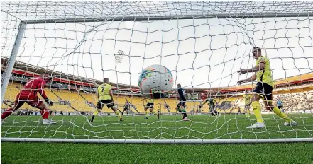  ?? GETTY IMAGES ?? Phoenix goalkeeper Stefan Marinovic, left, and defender Steven Taylor, right, watch on in horror as Besart Berisha ripples the back of the net with a first-half strike while, below, Berisha celebrates the moment on Sunday.