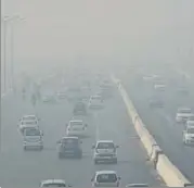  ?? MOHD ZAKIR/HT PHOTO ?? NH 24 engulfed in thick smog on Thursday. SAFAR predicted that the air quality could worsen in next two days.