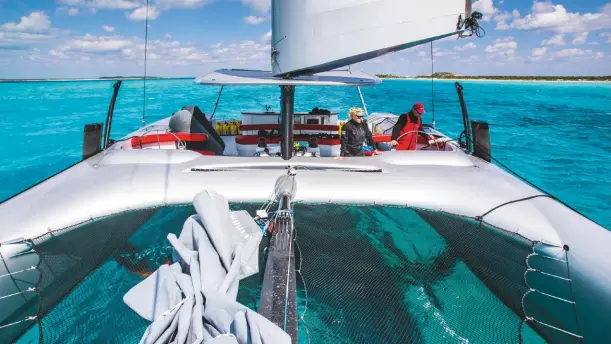  ??  ?? Entering Compass Cay after a blast from Staniel Cay. A narrow channel leads to a very sheltered inner harbour at Compass Cay, which we approached by sailing dead slow, with the wing limiter released so the wing could rotate and ‘feather’