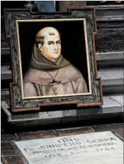  ?? DAVID ROYAL/THE MONTEREY COUNTY HERALD 2015 ?? Stanford University announced it will drop the name of 18th-century priest Junipero Serra — seen in a painting above his grave — from two dormitorie­s and its mailing address.