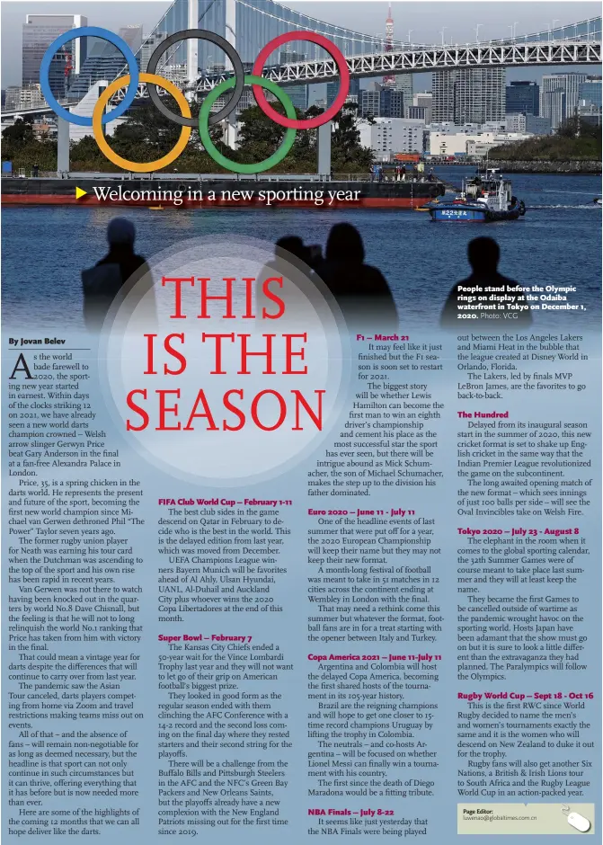  ?? Photo: VCG ?? People stand before the Olympic rings on display at the Odaiba waterfront in Tokyo on December 1, 2020.