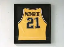  ?? ?? The framed jersey of St. Maria Goretti boys basketball’s greatest player, 1987 graduate Rodney Monroe, hangs in the front hallway at the Gael Center. Monroe, a BCL Hall of Famer whose 3,047 career points is still a Maryland high school state record, went on to star at North Carolina State and play one season in the NBA for the Atlanta Hawks.