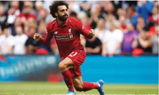  ?? – Reuters ?? ON TARGET: Liverpool’s Mohamed Salah celebrates scoring their first goal against West Ham United at Anfield.