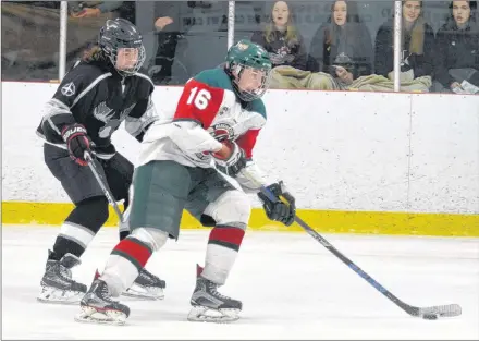  ?? JASON SIMMONDS/JOURNAL PIONEER ?? Kensington Wild forward Lucas Parsons, 16, carries the puck into the offensive zone during Saturday night’s New Brunswick/P.E.I. Major Midget Hockey League game against the Northern Moose from Bathurst, N.B. Parsons scored two goals in the Wild’s 7-2 victory at Credit Union Centre in Kensington.