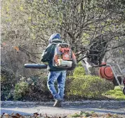  ?? H John Voorhees III/Hearst Connecticu­t Media file photo ?? A worker for Signature Landscapin­g in Norwalk uses a gas-powered leaf blower in Wilton in 2022.