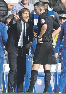  ?? Picture: AFP ?? ANGRY. Chelsea manager Antonio Conte argues with referee Michael Oliver after he sent defender David Luiz off at Stamford Bridge yesterday.