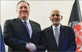  ?? ANDREW CABALLERO-REYNOLDS / AP ?? U.S. Secretary of State Mike Pompeo (left) shakes hands with Afghan President Ashraf Ghani during the 56th Munich Security Conference (MSC) in Munich, southern Germany, on Friday.