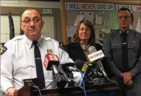  ?? PAUL POST — TROY RECORD ?? Troy Police Chief John Tedesco, left, answers questions at a press conference Saturday after the arrests of two men in connection with the four killings at a Second Avenue apartment. With Tedesco is Troy Deputy Mayor Monica Kurzejeski, center, and...