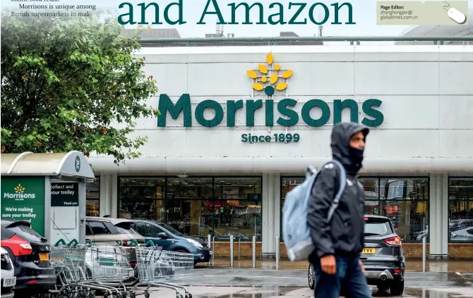  ?? Photo: AFP ?? A man walks past a Morrisons supermarke­t in Stratford, east London on June 21.