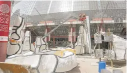  ?? ?? The “Monument with Standing Beast” sculpture, a 29-foot tall structure that has stood outside the Thompson Center since 1984, was removed Thursday. It will be kept at a state facility until it’s moved to the Art Institute of Chicago.