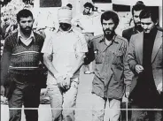  ?? AP file photo ?? A hostage from the U.S. Embassy is displayed to a crowd in Tehran, Iran, on Nov. 9, 1979.