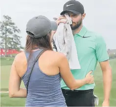  ??  ?? Kyle Stanley of the United States celebrates with his wife Dolly after defeating Charles Howell III of the United States during a playoff in the final round of the Quicken Loans National TPC Potomac in Potomac, Maryland. — AFP photo