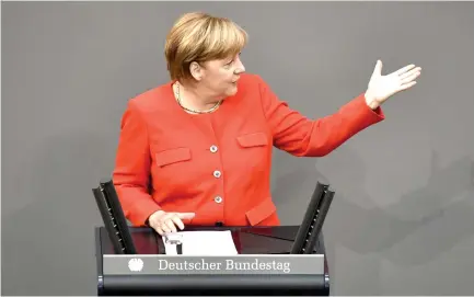  ??  ?? German Chancellor Angela Merkel delivers a speech in Berlin on Wednesday. (AFP)