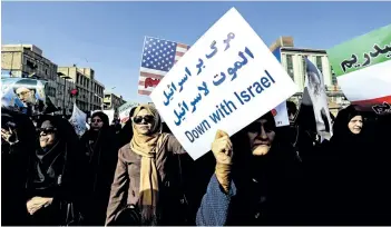  ?? MORTEZA JABERIAN/TASNIM NEWS AGENCY VIA AP ?? Women attend a pro-government demonstrat­ion in the southweste­rn city of Ahvaz, Iran, on Wednesday.