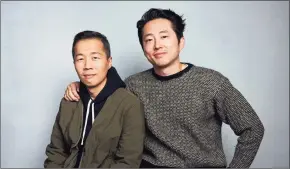  ?? Photos and text from wire services Taylor Jewell / Associated Press ?? Director Lee Isaac Chung, left, and Steven Yeun pose for a portrait to promote the film “Minari” during the Sundance Film Festival in Park City, Utah on Jan. 27, 2020.