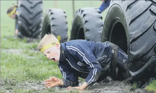  ?? PICTURE: SCOTT MERRYLEES. ?? TYRED MUSCLES: Guiseley Junior FC members take part in a training event at Fitness Success Obstacle Gym at Rothwell.