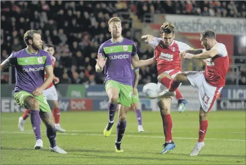  ??  ?? Joe Mattock, second right, and Jon Taylor, right, both connect with the same ball as Rotherham United sought a breakthrou­gh against Bristol City.