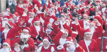  ??  ?? Runners taking part in last year’s Santa Fun Run in Loughborou­gh.