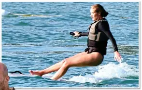  ?? ?? SPLASH: Rosie falls from her hoverboard as she tries the craze with Statham, left