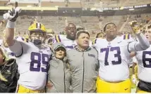  ?? AP/FILE ?? The Hurricanes will open the 2018 season on Sept. 2 against LSU and coach Ed Orgeron, center, in the Advocare Classic at AT&T Stadium in Arlington, Texas.