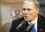  ?? TED S. WARREN / ASSOCIATED PRESS ?? “We know that when D.C. fails to act, Washington state has to do so,” Gov. Jay Inslee said Monday before signing the bipartisan measure.