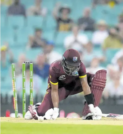  ?? AP ?? The West Indies’ Shai Hope kneels on the ground after he is bowled by Australia’s Josh Hazlewood during their One-Day internatio­nal cricket match in Sydney, Australia, yesterday.