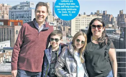  ??  ?? The Leitners are hoping that bike rides will help ease the no-camp doldrums for Zack, 10, and Sasha, 12.