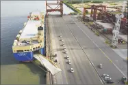  ?? Getty Images ?? Vehicles for export are loaded onto a ship in Shenzhen, China. China on Thursday urged U.S. companies to lobby American leaders on the countries’ growing trade war.