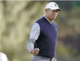  ?? AP FOTO ?? TURNING BACK THE CLOCK. Tiger Woods goes 5-under in the first four holes for the first time in 10 years.