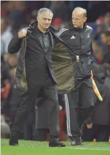 ?? — AFP ?? Manchester United manager Jose Mourinho leaves following the UEFA Champions League Group A match between Manchester United and Basel at Old Trafford in Manchester. Manchester United won 3-0.