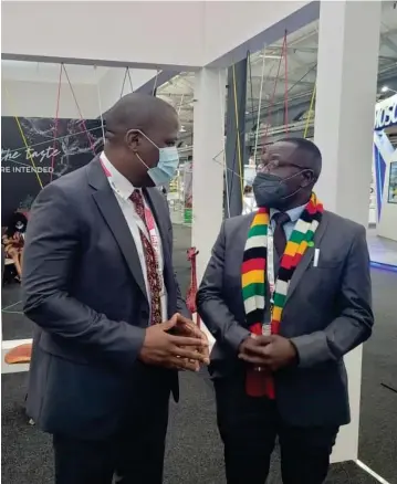  ?? ?? Foreign Affairs and Internatio­nal Trade Deputy Minister David Musabayana (with scarf) tours the Zimbabwe pavilion at
IATF in Durban last week in the company of ZimTrade chief executive Allan Majuru