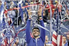  ?? Picture: MIKE SEGAR, REUTERS ?? NEW YORK’S FINEST: Novak Djokovic hold’s up the US Open trophy after defeating Roger Federer at Flushing Meadows yesterday.