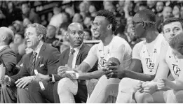  ?? COURTESY OF UCF ATHLETICS ?? Former UCF basketball assistant coach Jamill Jones, center, was charged with assault after he was accused of punching a New York City tourist who later died.