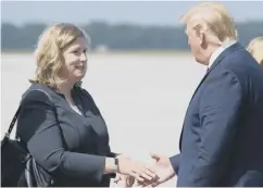  ??  ?? 0 Donald Trump is met by Dayton mayor Nan Whaley