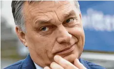  ?? Foto: Thierry Charlier, afp ?? Viktor Orbán will weitermach­en wie bisher und zeigt sich äußerlich unbeeindru­ckt von den Strafmaßna­hmen der EVP gegen seine Fidesz-Partei.