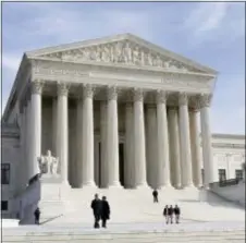  ?? J. SCOTT APPLEWHITE - THE ASSOCIATED PRESS ?? Shown in this 2012 photo is the U.S. Supreme Court Building in Washington. The Supreme Court enters its final week of work before a long summer hiatus with action expected on the Trump administra­tion’s travel ban and a decision due in a separation of...