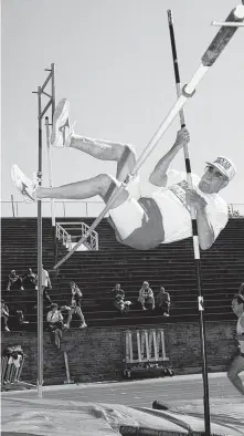  ?? Staff file photo ?? James Cordell, then 80, hurdles himself for the pole vault in the Senior Olympics at Rice Stadium in April 2000.