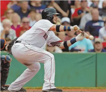  ?? STAFF PHOTO BY NANCY LANE ?? SOFT TOUCH: Catcher Jarrod Saltalamac­chia attempts a sacrifice bunt in the seventh inning of yesterday’s game. Lead runner Daniel Nava was thrown out at third.