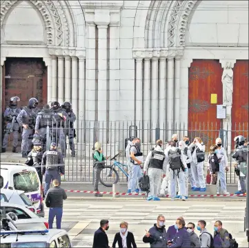  ?? AFP ?? Members of the French elite tactical police unit enter to search the Basilica of Notre Dame de Nice after the knife attack.