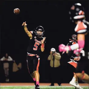  ?? David G Whitham / Hearst Connecticu­t Media ?? Shelton quarterbac­k Michael Kinik throws a pass against Hand on Friday.