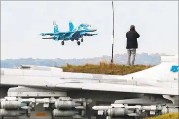  ?? Sergey Dolzhenko EPA/Shuttersto­ck ?? A UKRAINIAN fighter jet lands during training exercises in Ukraine last week. Members of the California National Guard’s 144th Fighter Wing group have been participat­ing in the multinatio­nal military exercises.