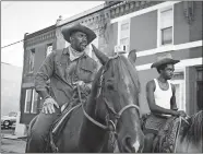  ?? AARON RICKETTS/NETFLIX ?? Idris Elba, left, and Caleb McLaughlin in “Concrete Cowboy.”