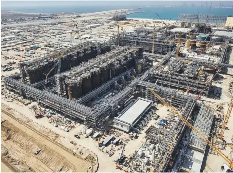  ?? EGA ?? Above, EGA’s $3.3bn Al Taweelah alumina refinery project, constructi­on of which is 82 per cent complete