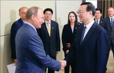  ?? YANG XUEQI / XINHUA ?? Russian President Vladimir Putin meets with Yang Jiechi, a member of the Political Bureau of the Communist Party of China Central Committee and director of the Office of the Foreign Affairs Commission of the CPC Central Committee, in Sochi, Russia on Wednesday.