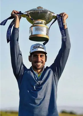  ??  ?? Spanish joy: Spain’s Rafael Cabrera Bello holding the trophy after winning the Scottish Open at Dundonald Links, Troon, Scotland, on Sunday. – AP