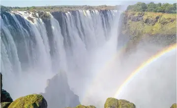  ?? ?? The majestic Victoria Falls mesmerises visitors with its thunderous cascades and misted rocks