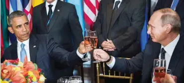  ?? Foto: dpa/United Nations ?? Obama (l). und Putin mochten als Gäste des UN-Generalsek­retärs einen Toast nicht verweigern.