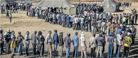  ?? Picture: LUIS TATO/AFP ?? LONG WAIT: People patiently queue to cast their ballot outside a polling station in the suburb of Mbare in Zimbabwe’s capital, Harare