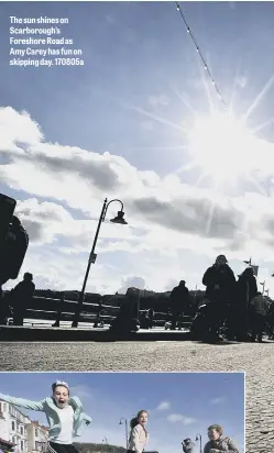  ??  ?? The sun shines on Scarboroug­h’s Foreshore Road as Amy Carey has fun on skipping day. 170805a