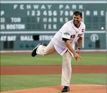  ?? Associated Press ?? Honored: Former Boston Red Sox player Jason Varitek throws out the ceremonial first pitch before a baseball game between the Red Sox and the Toronto Blue Jays in Boston in 2012. Varitek was honored for his time with the team in a pregame ceremony. The 50-year-old is headed back to where he burst through on the national scene when the Red Sox play the Baltimore Orioles on Sunday in the fifth MLB Little League Classic.